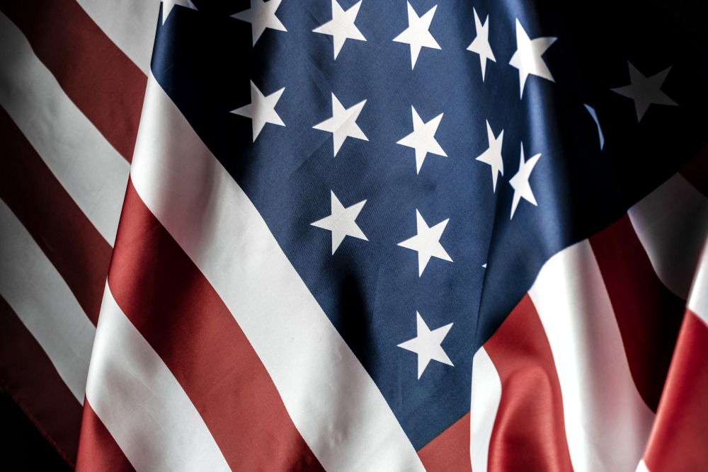 Draped American flag in dramatic lighting